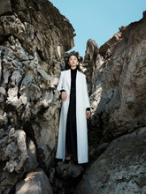 Tailored textured fabric long coat with peak lapels and buttoned cuffs for elegant layering