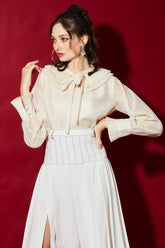 Silk blouse with pleated collar and sheer sleeves for elegant day-to-evening styling