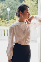 Silk blouse with structured collar and gathered sleeves for modern tailored elegance