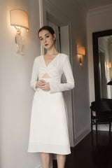 Long sleeve organza midi dress with twist-front detail and subtle cutout for elegant styling