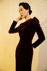 Velvet bodycon dress with ruched shoulder detail and long sleeves for formal evening occasions