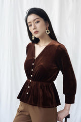 Velvet blouse with pearl button details and gathered waist for elegant shaping