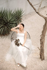 Sleeveless organza dress with soft tulle overlay and corset back detail for feminine elegance