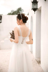 Sleeveless organza dress with soft tulle overlay and corset back detail for feminine elegance