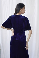 Velvet wrap midi dress with flutter sleeves and high slit for elegant evening styling
