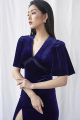 Velvet wrap midi dress with flutter sleeves and high slit for elegant evening styling