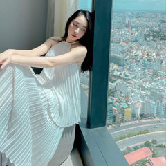 Halterneck Pleated Silk Midi Dress with Flowing A-Line Silhouette and Backless Detail