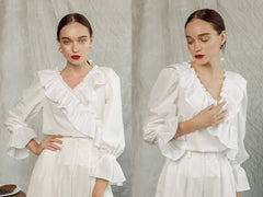 Silk blouse with ruffled V-neckline and flared cuffs for a romantic, feminine silhouette