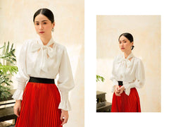 Silk blouse with statement neck tie and smocked cuffs for a polished and feminine silhouette