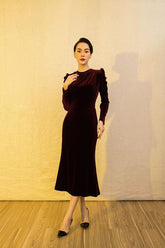 Velvet midi dress with ruched sleeves and fitted silhouette for elegant evening styling
