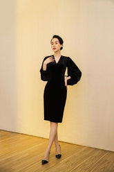 Velvet midi dress with V-neckline and gathered puff sleeves for elegant evening occasions