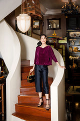 Pantalon court en velours taille haute avec jambe large et finition sur mesure pour une sophistication en soirée