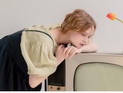 Robe longue en lin à ourlet volanté et boutonnée sur le devant