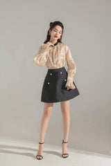Silk A-line skirt with pearl button accents and tailored structure for modern feminine style