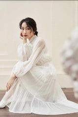 Sheer organza midi dress with pleated layers and bow collar detail for elegant styling