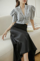 Tailored silk blouse with puffed sleeves and notched collar for elegant structured styling