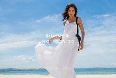 Flowy pleated silk dress with wide shoulder straps and bow-tie accents