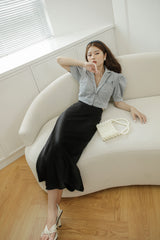 Tailored silk blouse with puffed sleeves and notched collar for elegant structured styling