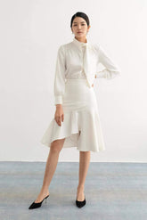 Silk blouse with high neckline, sculpted necktie detail, and tailored long sleeves