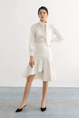 Silk blouse with high neckline, sculpted necktie detail, and tailored long sleeves