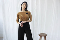 Soft velvet blouse with boat neckline and fitted silhouette for elegant occasion wear