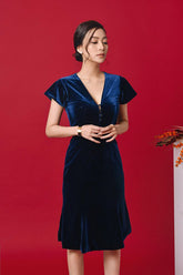 Velvet midi dress with V-neckline, flutter sleeves, and front button embellishment