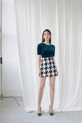 Fitted velvet blouse with half sleeves and pearl button-back detail for evening styling