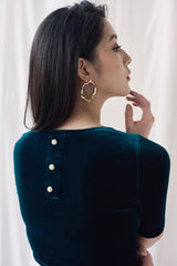 Fitted velvet blouse with half sleeves and pearl button-back detail for evening styling