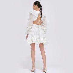 Tiered ruffle mini dress in sheer organza with balloon sleeves and open back tie detail