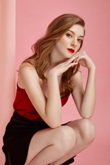 Velvet ruched mini skirt with flared hem and high-rise fit for festive and evening styling