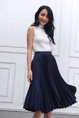 Sleeveless mock neck silk top with ribbed texture and elegant tailored silhouette