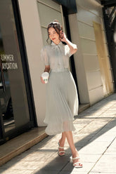 Short-sleeve organza blouse with necktie detail and puff sleeves for airy elegance