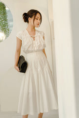 Cotton poplin midi skirt with high waist, paneled construction, and flared silhouette