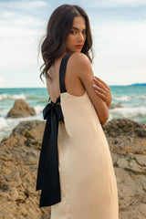 Sleeveless silk midi dress with contrast straps and back bow detail for elegant styling
