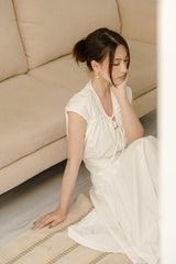 Cotton poplin midi skirt with high waist, paneled construction, and flared silhouette