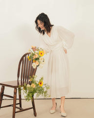 Organza midi dress with wrap-style bodice and billowy sleeves for soft feminine elegance