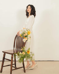 Organza midi dress with wrap-style bodice and billowy sleeves for soft feminine elegance