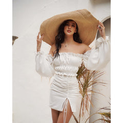Silk blouse with off-shoulder neckline and ruched puff sleeves paired with ruched silk skirt