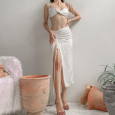 Silk crop top with twist-front detail, adjustable shoulder ties, and bandeau-style silhouette