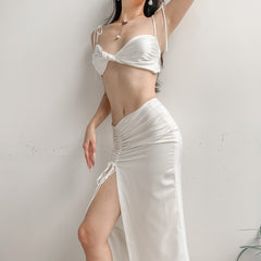Silk crop top with twist-front detail, adjustable shoulder ties, and bandeau-style silhouette