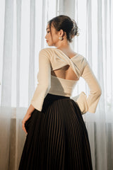 Structured open-back blouse in ribbed cotton with asymmetric neckline and fitted sleeves