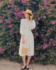 Silk midi dress with puff sleeves and waist tie detail for a classic feminine silhouette