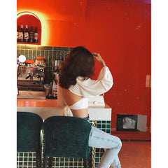 Silk blouse with open back and tie detail – long puff sleeves and deep V neckline