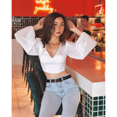 Silk blouse with open back and tie detail – long puff sleeves and deep V neckline