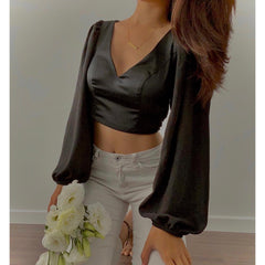 Silk blouse with open back and tie detail – long puff sleeves and deep V neckline