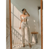 Silk crop top with tie-front detail and adjustable shoulder straps for statement summer styling