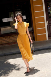 Short sleeve button-down silk blouse with pleated ruffle trim and structured collar