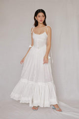 Sleeveless organza midi dress with tassel tie straps and gathered hemline detail