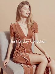 Velvet wrap midi dress with puff sleeves and deep V-neckline for elegant day-to-evening wear