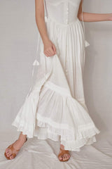 Sleeveless organza midi dress with tassel tie straps and gathered hemline detail